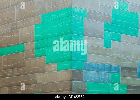 The building's facade is covered with decorative tiles on rivets Stock Photo