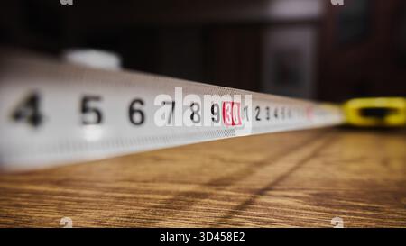 Close up view of a measuring tape on a table Stock Photo