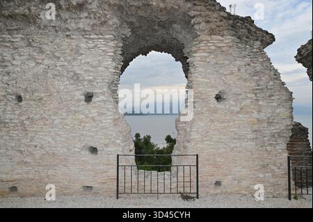 Lake View In The Ruins Of The Grottoes Of Catullus At Lake Garda In Sirmione Italy On A Wonderful Sunny Autumn Day With A Few Clouds In The Sky Stock Photo