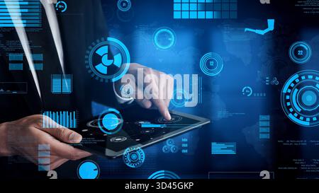 A businessman interacts with a tablet displaying a modern digital interface featuring analytics, graphs, and data visualization, illustrating Stock Photo