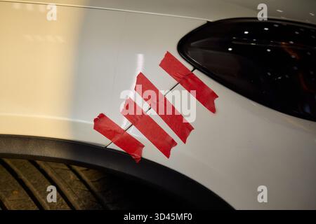 Vehicle damage analysis, Photographic focus on car bumper with visible wear marks, In-depth view highlighting vehicle panel conditions under Stock Photo