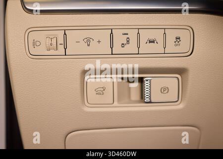 Closer view of dashboard controls featuring illumination and safety icons, Detailed snapshot of vehicle dashboard with various illuminated safety and Stock Photo