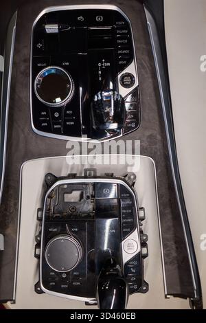 Automotive gear overview, Urban inspired vehicle interior showing gear shift and control features, Detailed shot of car gear selector with glossy knob Stock Photo