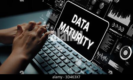 Hands Typing on Keyboard with Digital Dashboard Displaying Data Maturity Metrics and Analytics Overview for Business Intelligence. Asymptotic smart Stock Photo