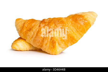 Side view of two brown or golden croissants in stack is isolated on white background with clipping path Stock Photo