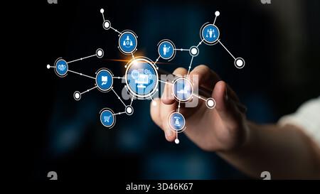 A hand interacts with a digital interface showcasing various technology concepts, emphasizing the importance of data and analytics in modern business Stock Photo