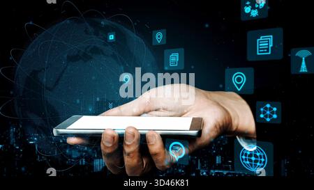 A hand holding a smartphone surrounded by digital icons and a globe, symbolizing the integration of technology in communication and information Stock Photo