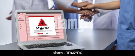 Cyber attacking concept. Malware alert showing on computer screen display scam and threat detection on computer system or online server to be removed Stock Photo