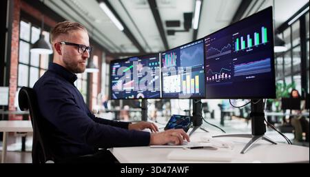 Male Analyst Uses Technology To Predict Business Market Performance Data Stock Photo