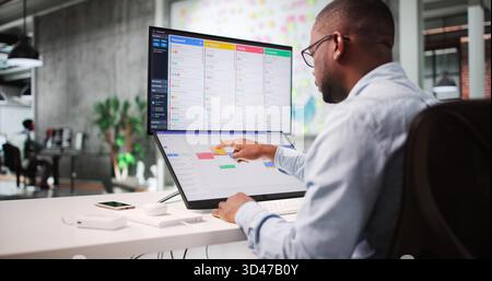 Time Management Project: Agile Scrum Calendar On Office Screen Stock Photo