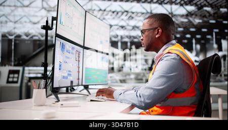Male Engineer At Automotive Factory Designs 3D Floor Plan On Computer Screen Stock Photo