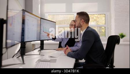 Financial Advisor And Accountant Analyzing Data In Modern Office Stock Photo