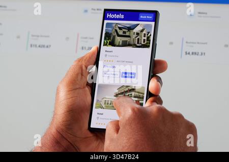 African American Man Using Smartphone To Search And Book Hotel. Stock Photo