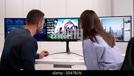Professional Video Editor And Graphic Designer Working On Computer Projects Stock Photo