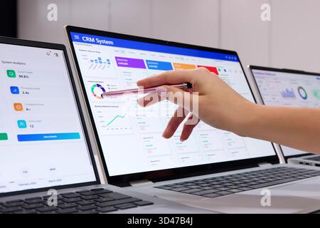 Businessman Enhances Customer Relationships And Boosts Sales Using CRM Software Stock Photo