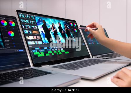 Professional Graphic Designer Editing A Photo On Her Laptop Screen Stock Photo