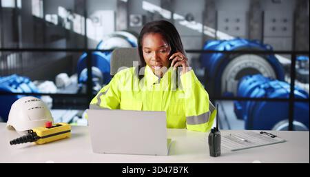 Female African Engineer Designs Gas Turbine Power Plant Using Laptop. Stock Photo