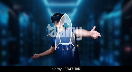 A young man wearing a virtual reality headset engages with a rocket symbol, symbolizing ambition and innovation in startup business concepts within a Stock Photo