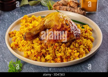 Roasted chicken leg with yellow curry rice Stock Photo - Alamy