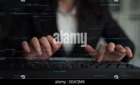 Close-up view of hands typing on a keyboard, overlaid with digital code to depict themes of programming and software development in a sleek, modern Stock Photo