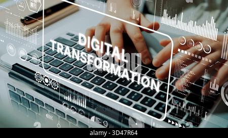 Hands on Laptop Keyboard with Digital Transformation Theme and Data Graphics Overlaying Image for Technology and Innovation Concepts. Asymptotic smart Stock Photo