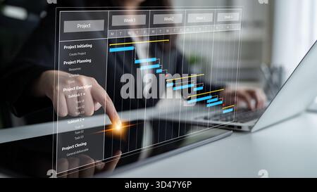 A professional businesswoman engages with a digital project management Gantt chart displayed on her laptop, highlighting tasks and timelines in a Stock Photo