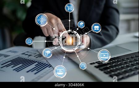 A business professional interacts with a smartphone while surrounded by digital icons representing online services, showcasing the blend of technology Stock Photo