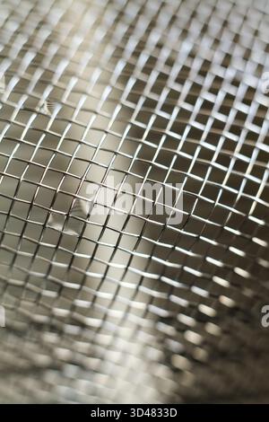 Close up of a stainless steel mesh for background or texture use. Stock Photo