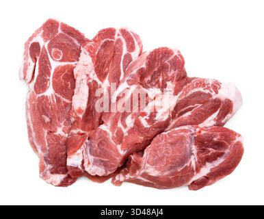A close-up of a stack of raw pork neck steaks (collar chops), showing beautiful marbling and fat, isolated on white. High quality photo Stock Photo
