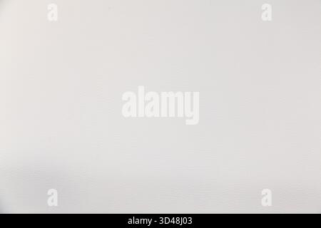 Texture of white leather upholstery of a chair close-up. White leather background Stock Photo