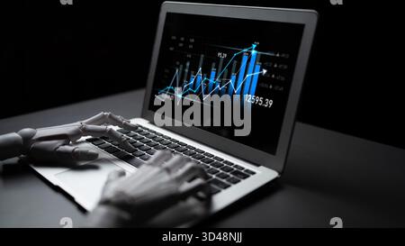 A creative representation of technology, featuring robot hands typing on a laptop with financial graphs and data, symbolizing innovation in economics Stock Photo