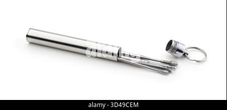 New set of metal ear cleaning tools isolated on white. Stock Photo