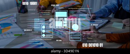 A modern workspace illustrates collaboration with data visualization charts on a table, showcasing professionals engaged in planning, analysis, and Stock Photo