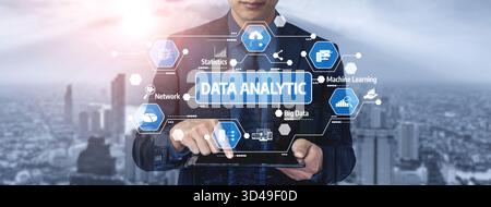 A business professional engages with a digital tablet displaying various data analytic icons against a modern city skyline that symbolizes innovation Stock Photo