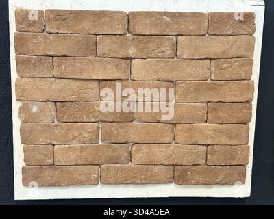 Decorative Wall Cladding with Textured Gray Stone Tiles Stock Photo