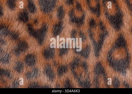 Dark leopard faux fur macro photo as a background. Horizontal leopard background. Stock Photo