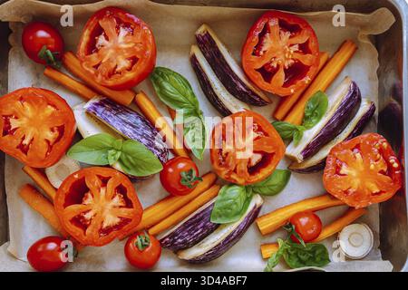 Autumn vegetables carrots, tomato, eggplant, in roasting tray. Mediterranean oven vegetables on roasting tray Stock Photo