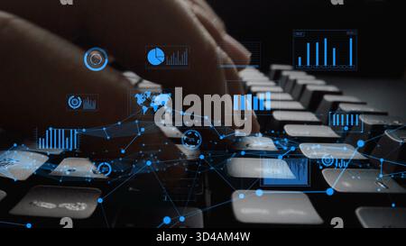 Focus on hands typing on keyboard with overlay of digital data visualizations, representing technology role in modern business analytics and decision Stock Photo