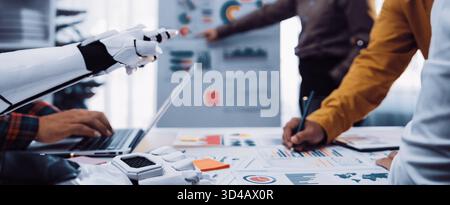 Business professionals integrating AI-powered insights into corporate strategy to refine planning, improve forecasting, and optimize workplace Stock Photo