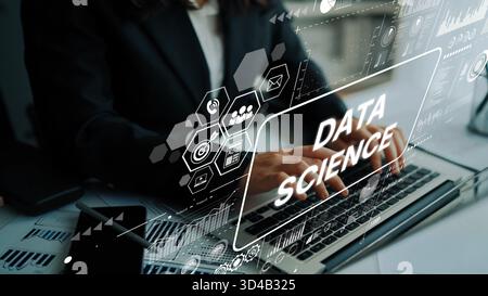 Professional working on data science project with digital interface and graphs on laptop in modern office environment. Asymptotic smart data analytic. Stock Photo