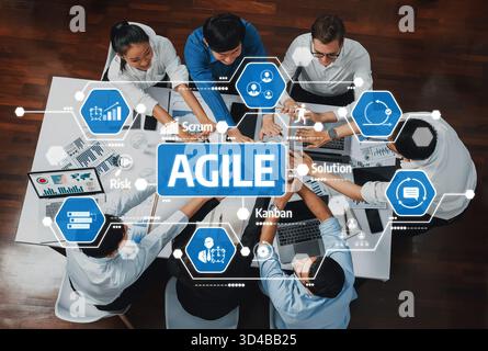 Diverse team engaged in an interactive meeting, highlighting Agile practices with a focus on Scrum and Kanban methodologies for effective project Stock Photo