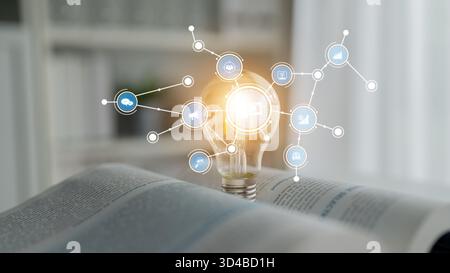 This image showcases a light bulb surrounded by digital icons symbolizing innovation and ideas, placed on an open book to represent knowledge and Stock Photo