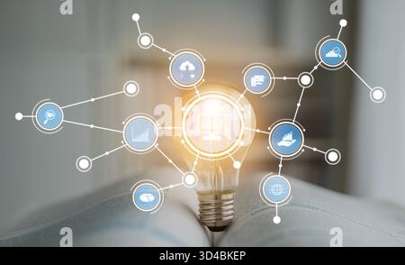 This image showcases a light bulb surrounded by various business icons, symbolizing innovation and the interconnectedness of ideas, technology, and Stock Photo