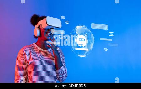 A young woman smiles while using virtual reality technology, interacting with a digital chatbot amid a vibrant blue environment, symbolizing the Stock Photo