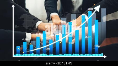 This image captures a dynamic scene of teamwork with hands coming together over an upward-trending financial chart, emphasizing collaboration and Stock Photo