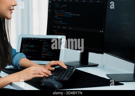 Cropped hands image of IT developer creating with typing information on pc with coding program information data website application, wearing jeans Stock Photo