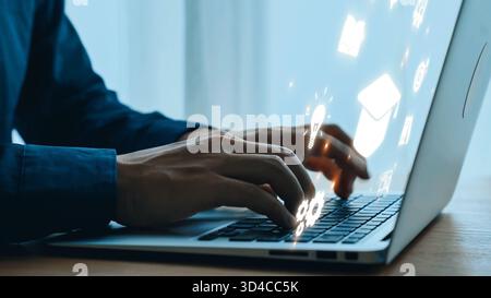 Hands Typing on Laptop with Floating Icons Representing Ideas, Innovation, Technology, and Communication in a Modern Workspace Setting. Qubit. Stock Photo