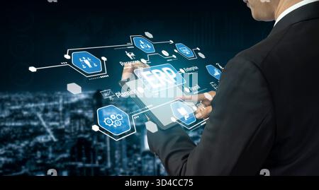 A businessman interacts with a tablet displaying digital icons related to enterprise resource planning, symbolizing innovation and technology in a Stock Photo