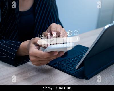 Close-up of hands using smartphone with AI chatbot and search interface, representing smart assistant technology, digital lifestyle, online search beh Stock Photo