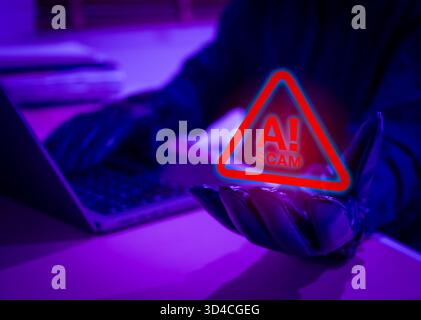 Gloved hand holding scam warning hologram with laptop in background, representing AI scam alert, cybercriminal activity, fraud detection, and technolo Stock Photo